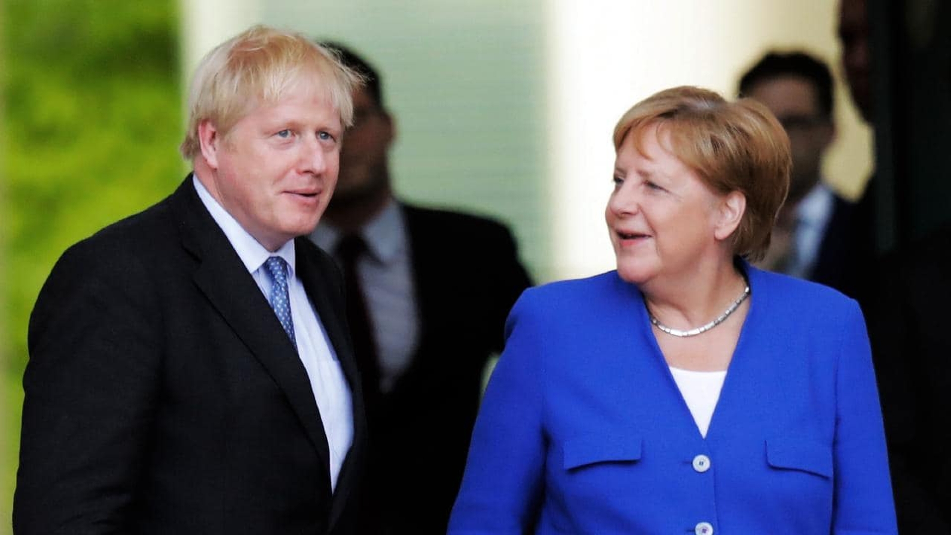 Boris Johnson + Angela Merkel